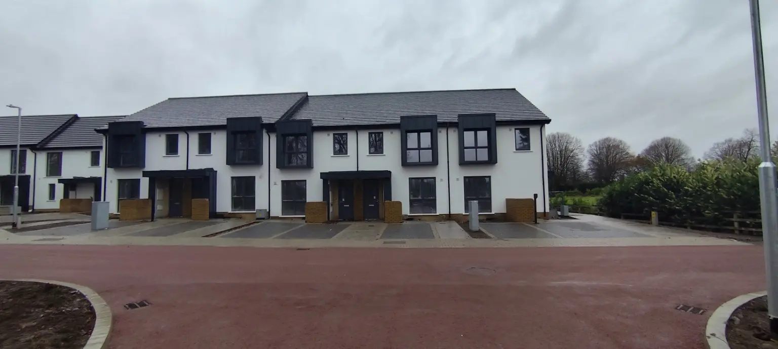 Housing development with metal-clad dormers