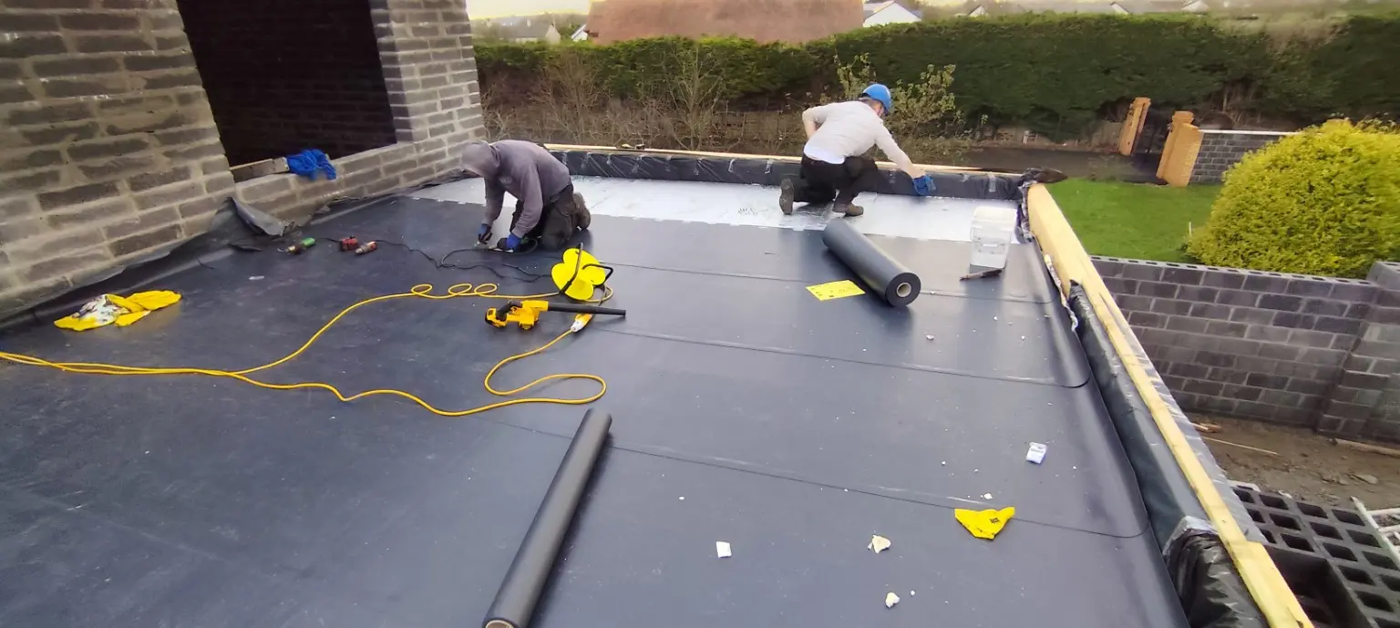 VRE team welding a PVC membrane roof