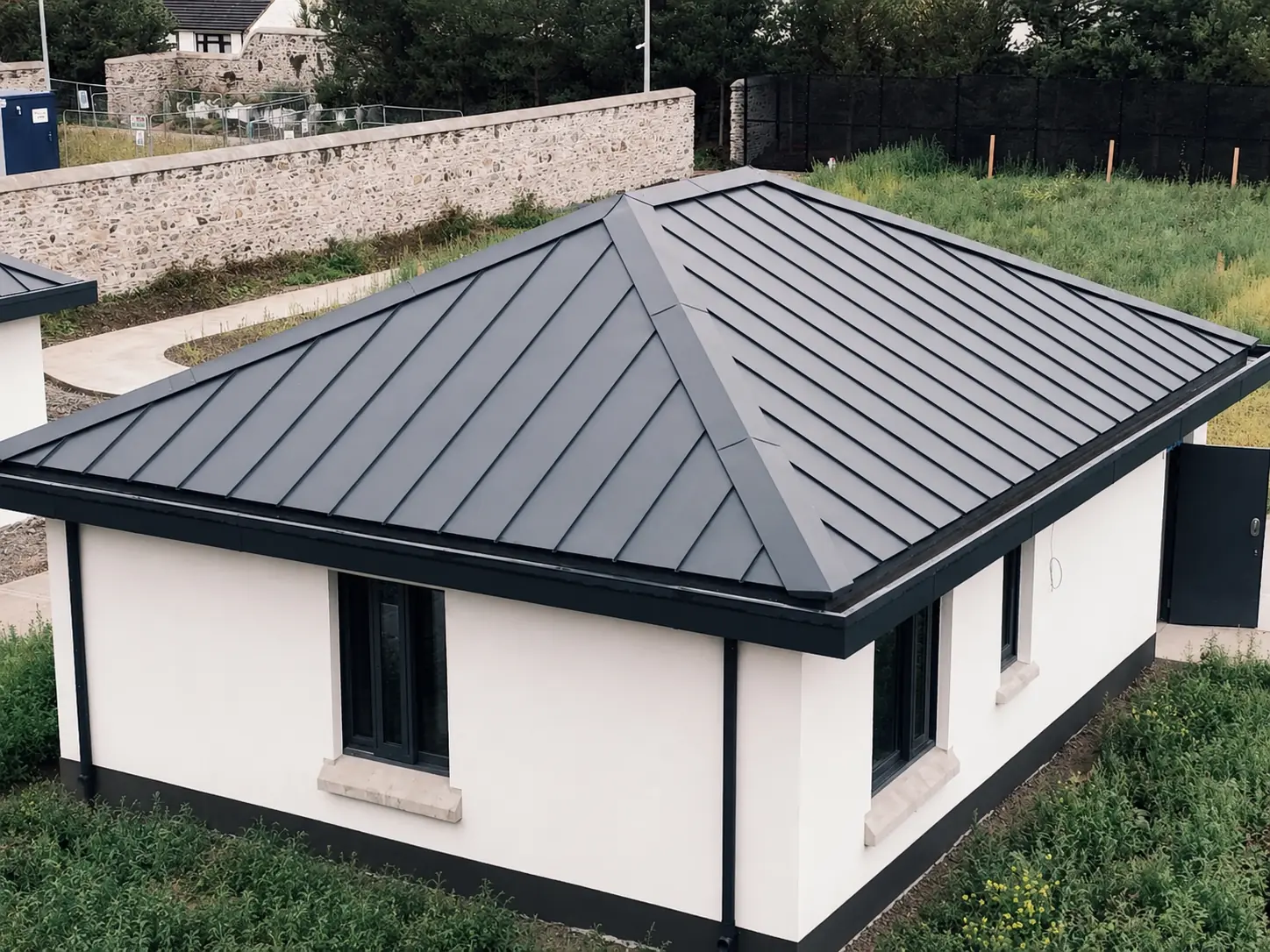 Completed standing seam metal roof by VRE